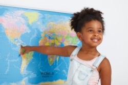 Student pointing at a world map